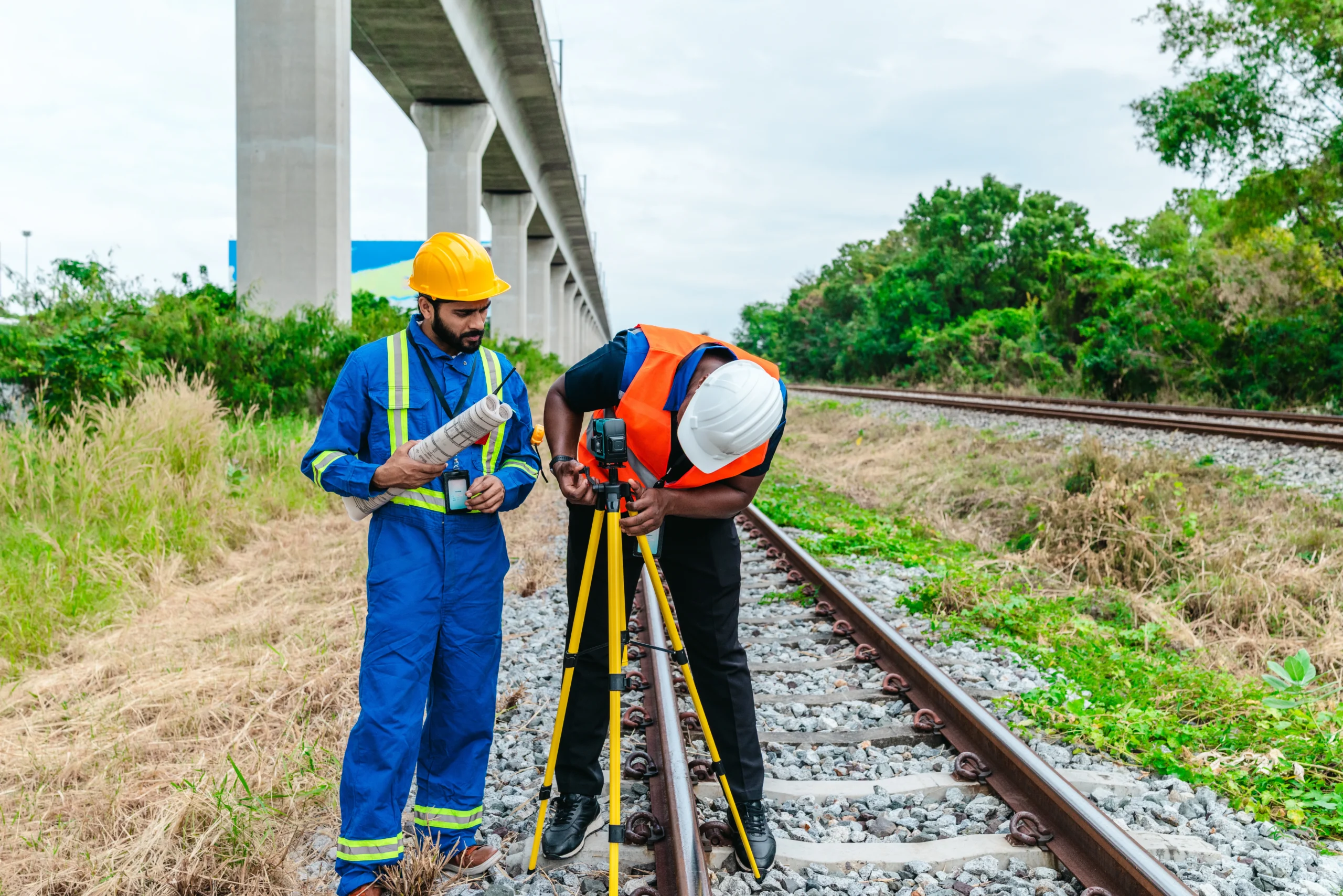 Team working along a railway corridor